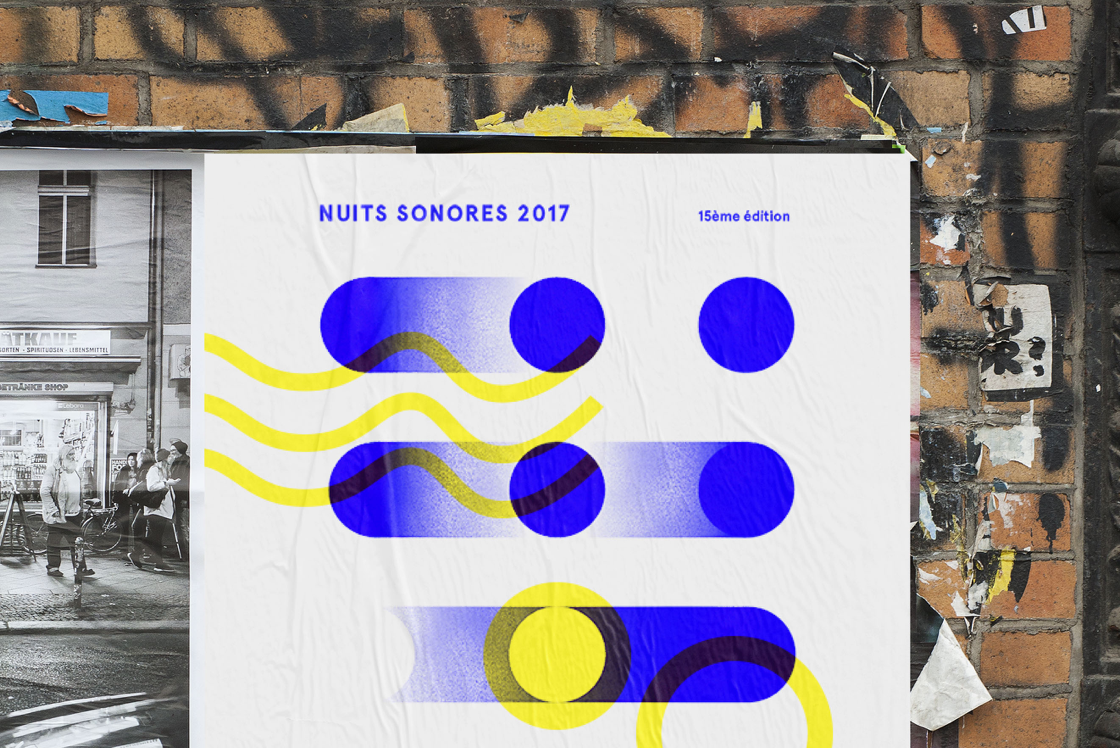 Morceau de l'affiche des nuits sonores sur un mur de brique